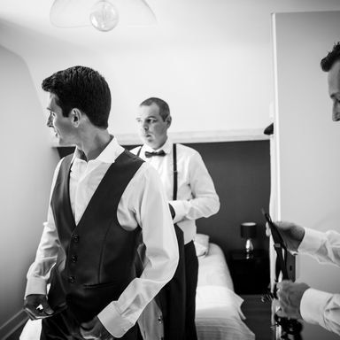 Wedding groom getting dressed black and white photo Cecilia Backlund k